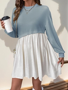 Detail of color-block casual dress with blue sweatshirt bodice and pleated white skirt