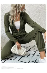 Detail view of army green long sleeve hooded jumpsuit with drawstring waist and zipper front