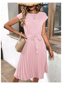 Detail view of the pink pleated dress showing short sleeves and a matching tie waist belt