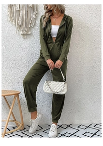 Detail of army green hooded jumpsuit with drawstring waist and zipper closure for women