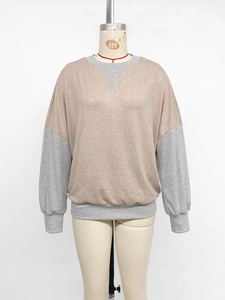 Detail of color-block crewneck sweatshirt with ribbed cuffs and contrast stitching
