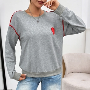 Grey oversized pullover sweatshirt with heart embroidery and red piping detail