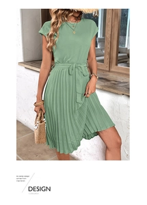 Detail of sage green pleated dress with short sleeves and elegant waist tie-belt