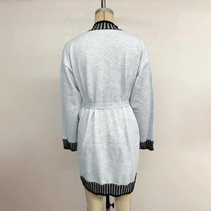 Light grey striped knitted dress with long sleeves and tie waist on mannequin