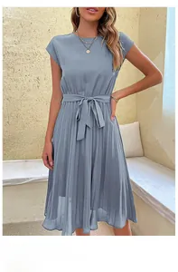 Detail of the pleated fabric texture and waist drawstring on a dusty blue dress