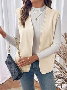 Detail of off-white polar fleece vest with sleeveless open-front design and textured fabric