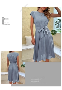 Detail of light blue short sleeve pleated dress with an elegant waist tie and bow