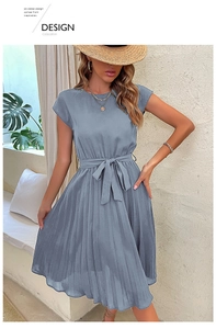 Detail view of smog blue pleated dress with adjustable waist tie and round neckline