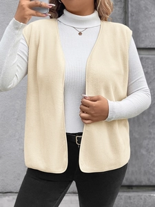 Detail of beige polar fleece vest showing premium soft texture and bound edge craftsmanship