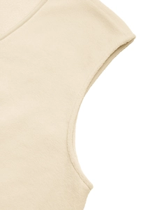 Detailed close-up of cream fleece fabric texture and high-quality stitching on the vest