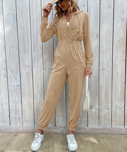 Detail view of khaki hooded jumpsuit featuring zipper front and drawstring waist design