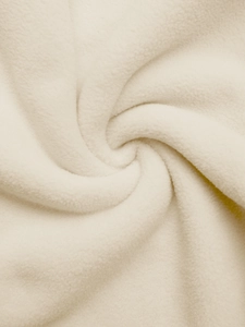 Macro shot of soft cream polar fleece fabric showing premium plush texture and warmth