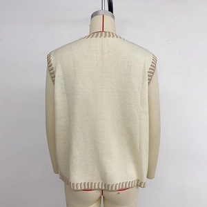 Women's V-neck knit vest sweater in cream with contrast brown stripe trim, back view