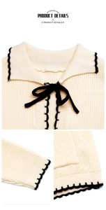 Détails du col à nœud et des bords festonnés sur ce gilet en maille contrastée