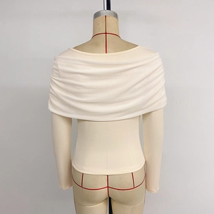 Elegant off-shoulder cream knit top with draped U-neck and bow-style knot design