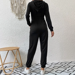 Women's black long sleeve hooded jumpsuit with elastic waist and drawstring detail