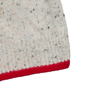 Detailed close-up of thick grey knit fabric with a vibrant red ribbed hem and flecked texture
