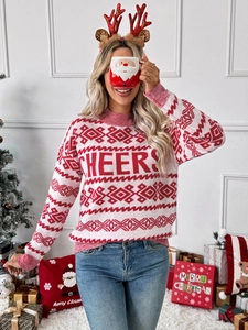 Detail of red and white Christmas sweater with CHEERS text and festive rib-knit collar