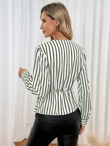 Detail of green and white striped long sleeve shirt with elasticated waist and V-neck back