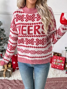 Detail of red and white Christmas knit sweater with Cheers text in a festive setting