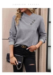 Detail of grey diamond jacquard waffle sweatshirt featuring asymmetrical buttoned cross collar