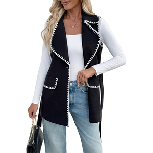 Gilet long noir pour femme avec bordures contrastées blanches et revers pour l'automne-hiver