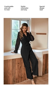 Detail of V-neck jumpsuit with sheer geometric lace sleeves and waist tie belt