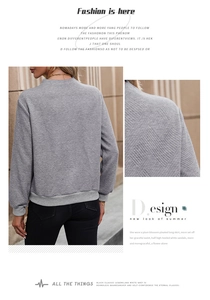 Detail of grey sweatshirt showing unique geometric diamond embossed texture and ribbed cuffs