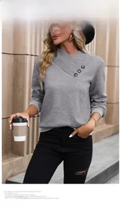 Detail of gray long-sleeve sweatshirt featuring V-neck buttons and diamond lattice texture