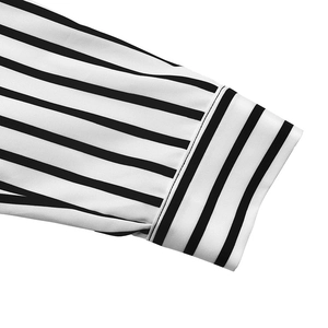 Macro shot of black and white striped shirt cuffs with premium stitching details