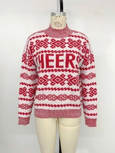 Detail of red and white knit sweater featuring Cheers jacquard and geometric patterns