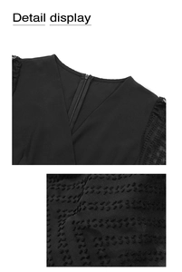 Detail view of the deep V-neckline with invisible zipper and black Swiss dot texture