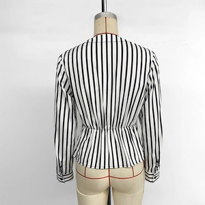 Back view of a striped V-neck long-sleeve shirt with waist tie and peplum hem details