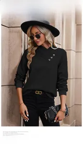 Detail of asymmetrical cross V-neck knit sweater with decorative shoulder buttons