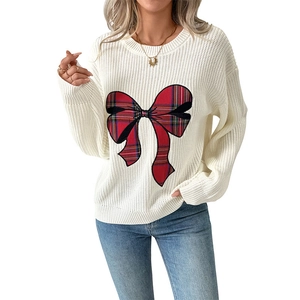 White crew neck sweater with a large festive plaid bow embroidery and ribbed cuffs