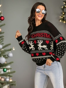 Detail of black Christmas sweater with reindeer patterns and Merry Christmas text