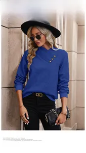 Detail of blue waffle knit top featuring a crossover neck with three decorative buttons