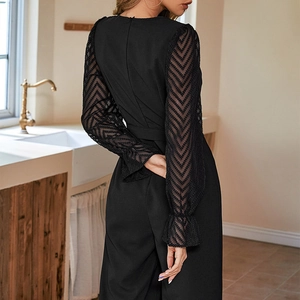 Elegant slim fit black jumpsuit for women with mesh wave pattern long sleeves and ruffles