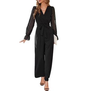 Elegant black long sleeve jumpsuit with V-neck, lace mesh sleeves and a matching belt