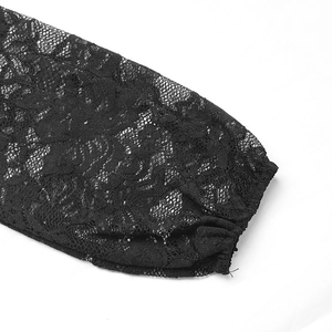 Close-up of elegant black floral lace fabric with intricate hollow embroidery patterns