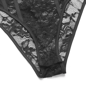 Detail shot of black floral lace texture and stitching on the elegant bodysuit