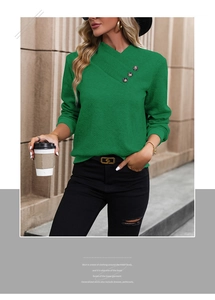 Detail of cross V-neck green sweatshirt with vintage buttons and chevron knit texture