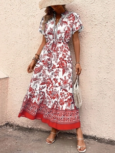 Detail of bohemian V-neck floral maxi dress with red print and decorative lace trim