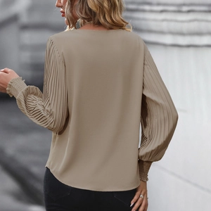 Elegant khaki pleated lantern sleeve blouse for women featuring a minimalist urban style
