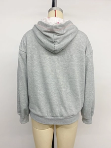 Detailed back view of a grey hoodie with floral lining and delicate lace trim on the hood