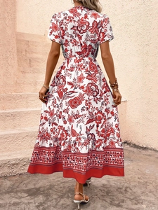 Detail of bohemian red floral maxi dress showing V-neck back and elegant high waist cut