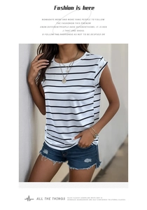 Close-up of sleeveless striped top with shoulder buttons and frayed denim shorts