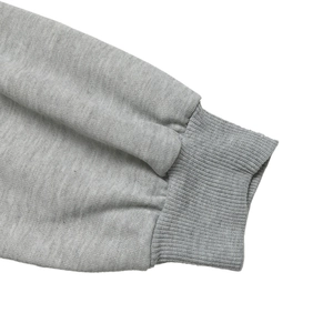 Close-up of gray hoodie ribbed cuffs showing high-quality knitted fabric texture