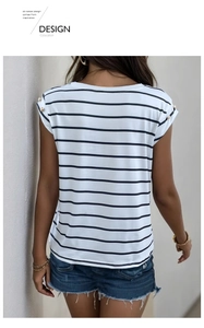 Detail view of black and white striped t-shirt with elegant shoulder button accents