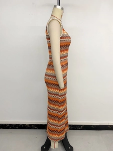 Close-up of knit fabric showing vibrant orange and brown bohemian zigzag pattern
